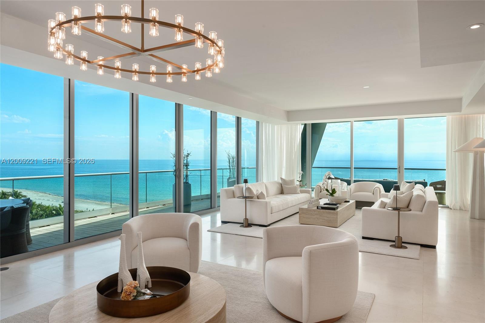 9349 Collins Avenue, Unit 801 Surfside, FL 33154 - Photo 2 of 59 a living room with furniture and a large window