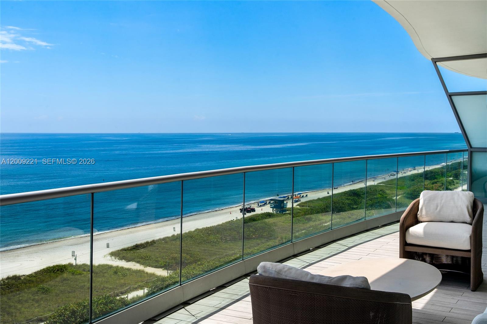 9349 Collins Avenue, Unit 801 Surfside, FL 33154 - Photo 26 of 59 a view of a two chairs in the patio