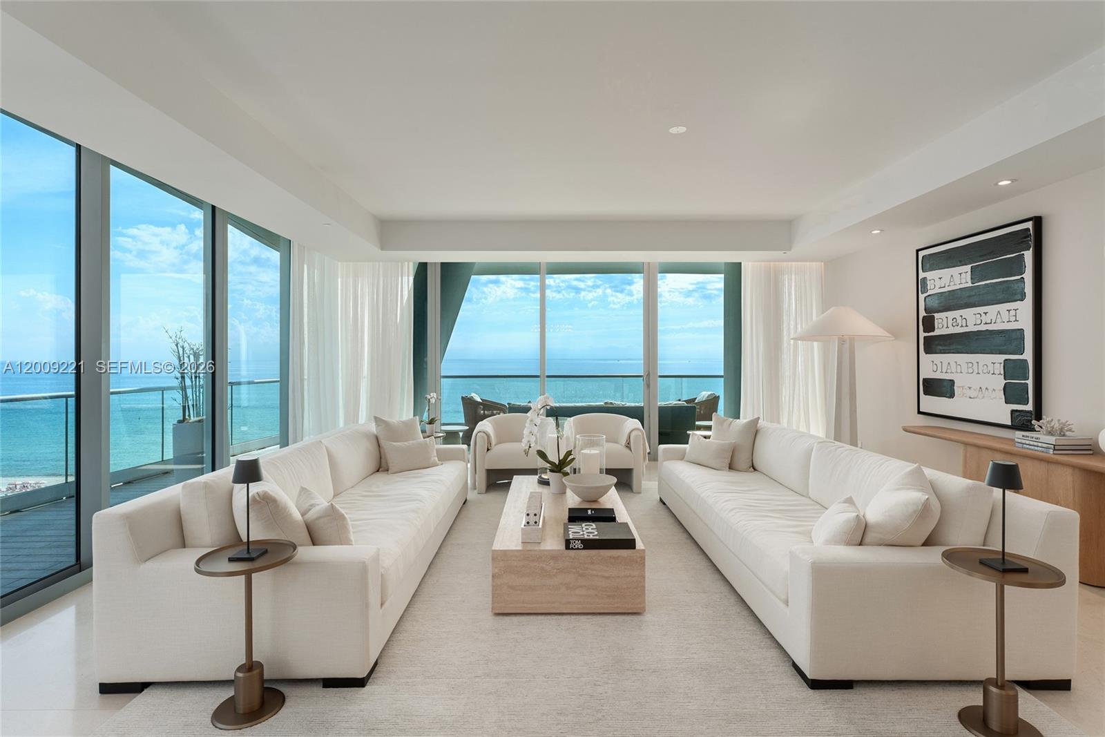 9349 Collins Avenue, Unit 801 Surfside, FL 33154 - Photo 3 of 59 a living room with furniture and large windows