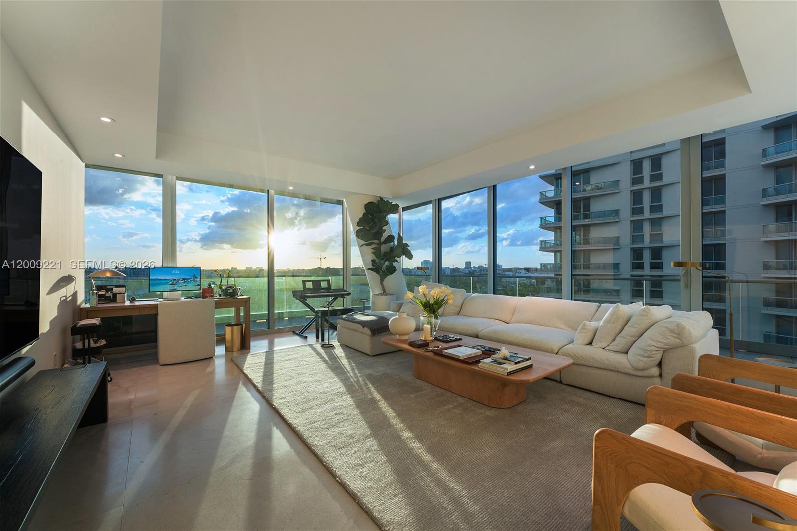 9349 Collins Avenue, Unit 801 Surfside, FL 33154 - Photo 38 of 59 a living room with furniture and a floor to ceiling window