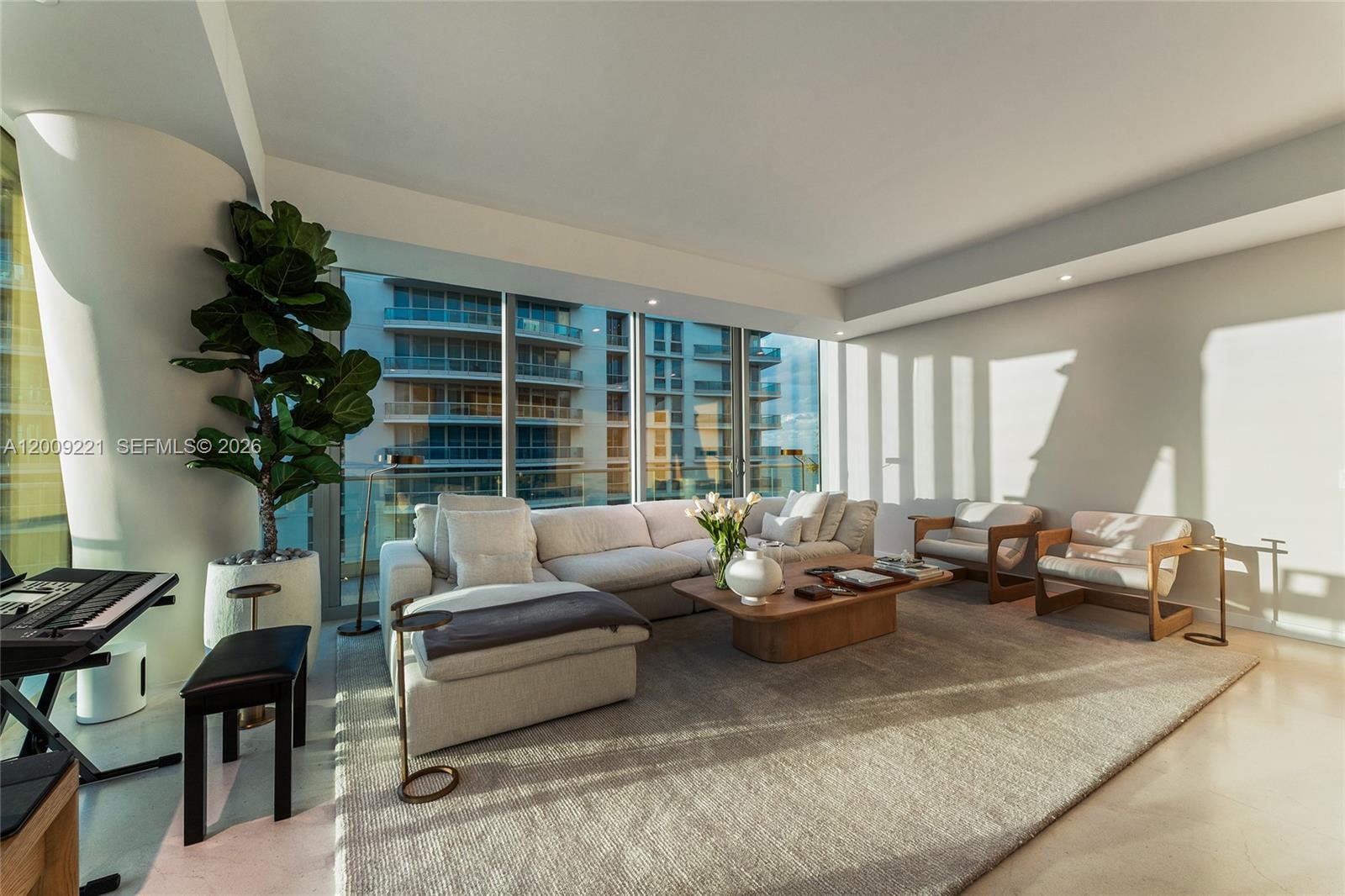 9349 Collins Avenue, Unit 801 Surfside, FL 33154 - Photo 39 of 59 a living room with furniture and a large window