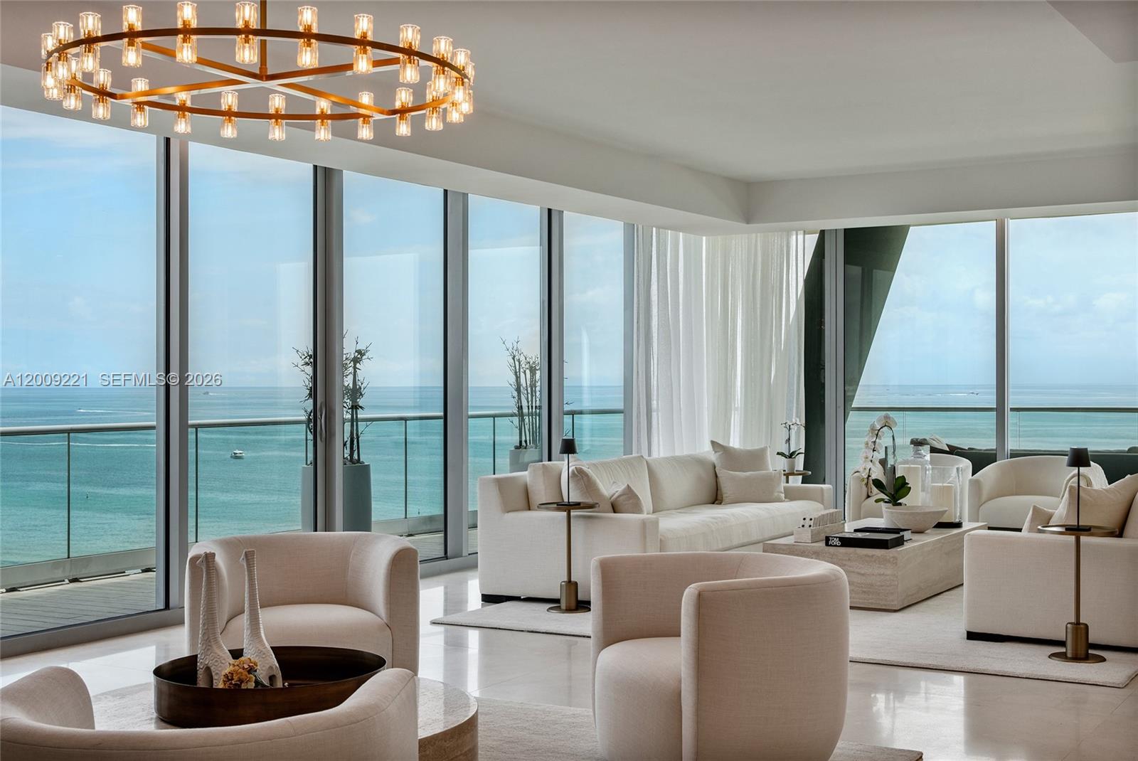 9349 Collins Avenue, Unit 801 Surfside, FL 33154 - Photo 10 of 59 a living room with furniture and a large window