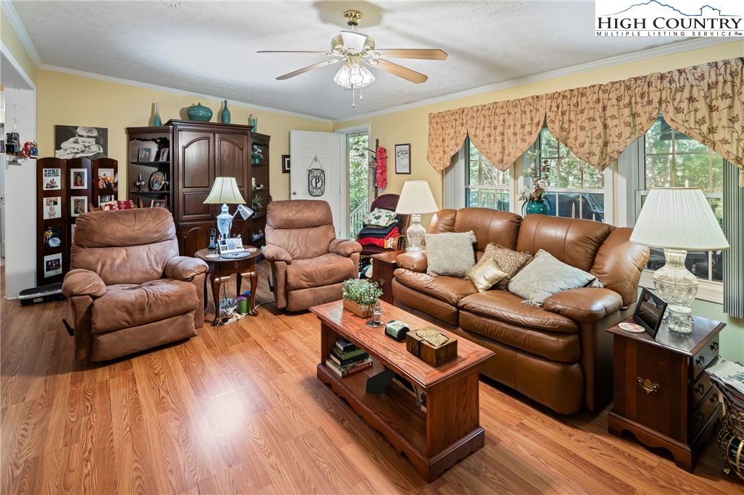 1169 Old Hampton Road Boone, NC 28607 - Photo 5 of 49 a living room with furniture fireplace and a large window