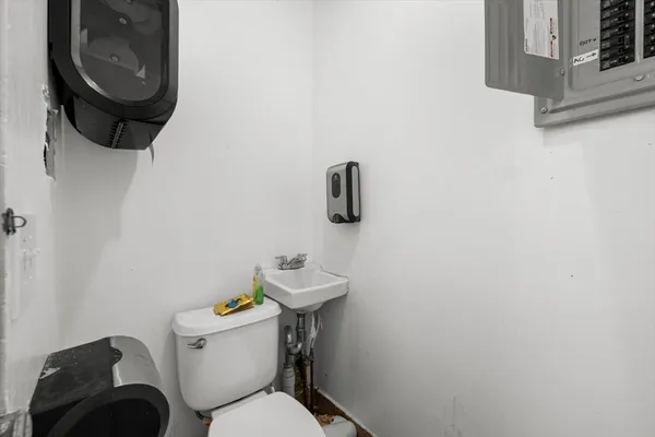 a bathroom with a toilet and a sink
