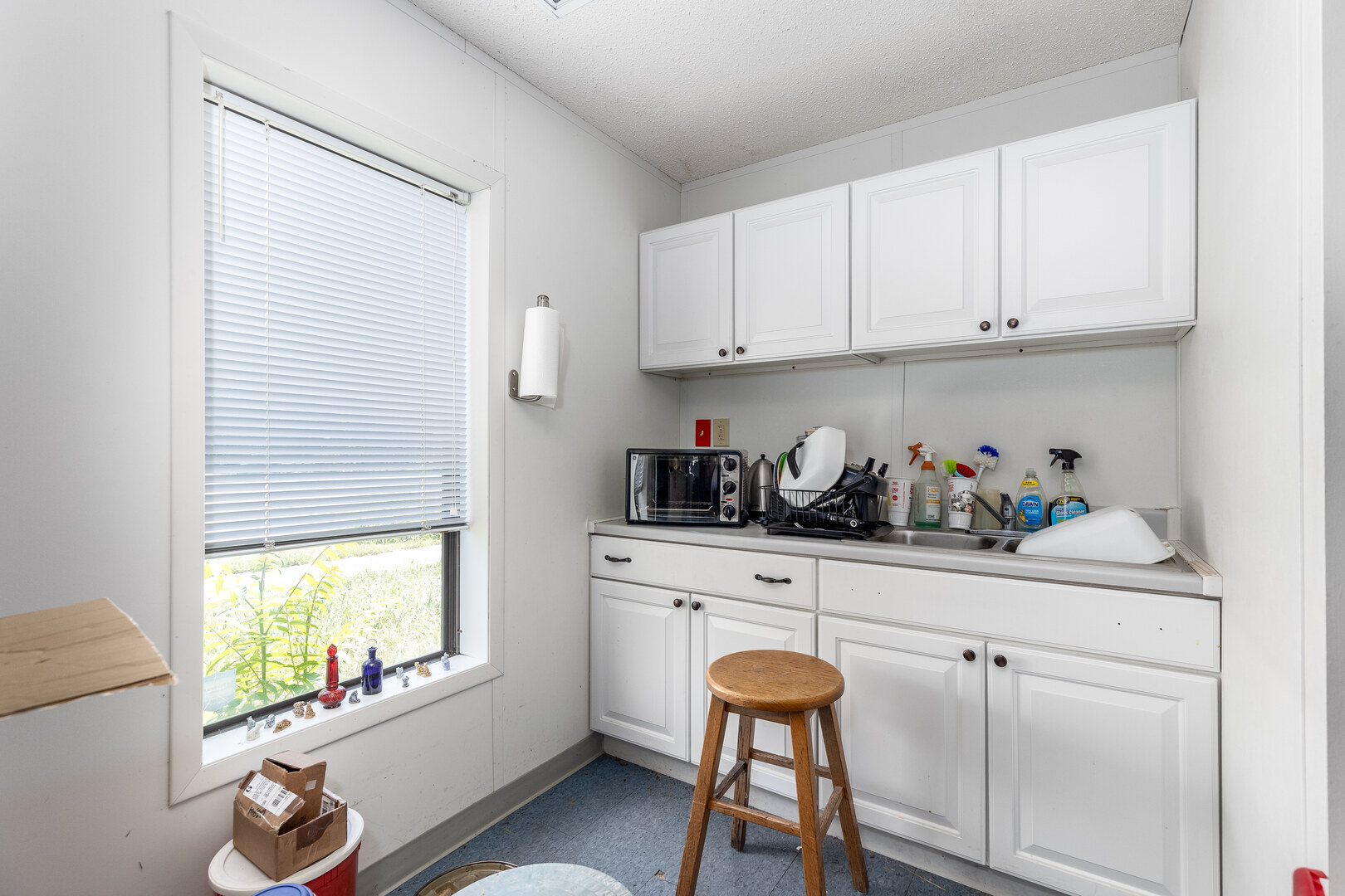 1313 Chestnut Street Ottawa, IL 61350 - Photo 15 of 30 a kitchen with stainless steel appliances granite countertop white cabinets and a window