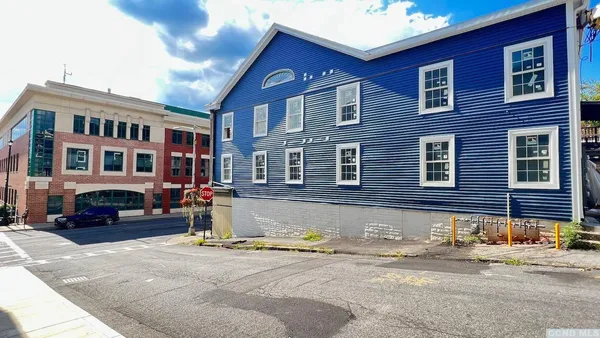 a front view of a building with street view