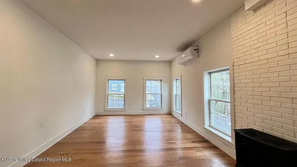 a view of livingroom with hardwood floor and hallway