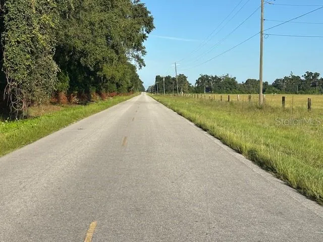 a view of a lake with a big yard