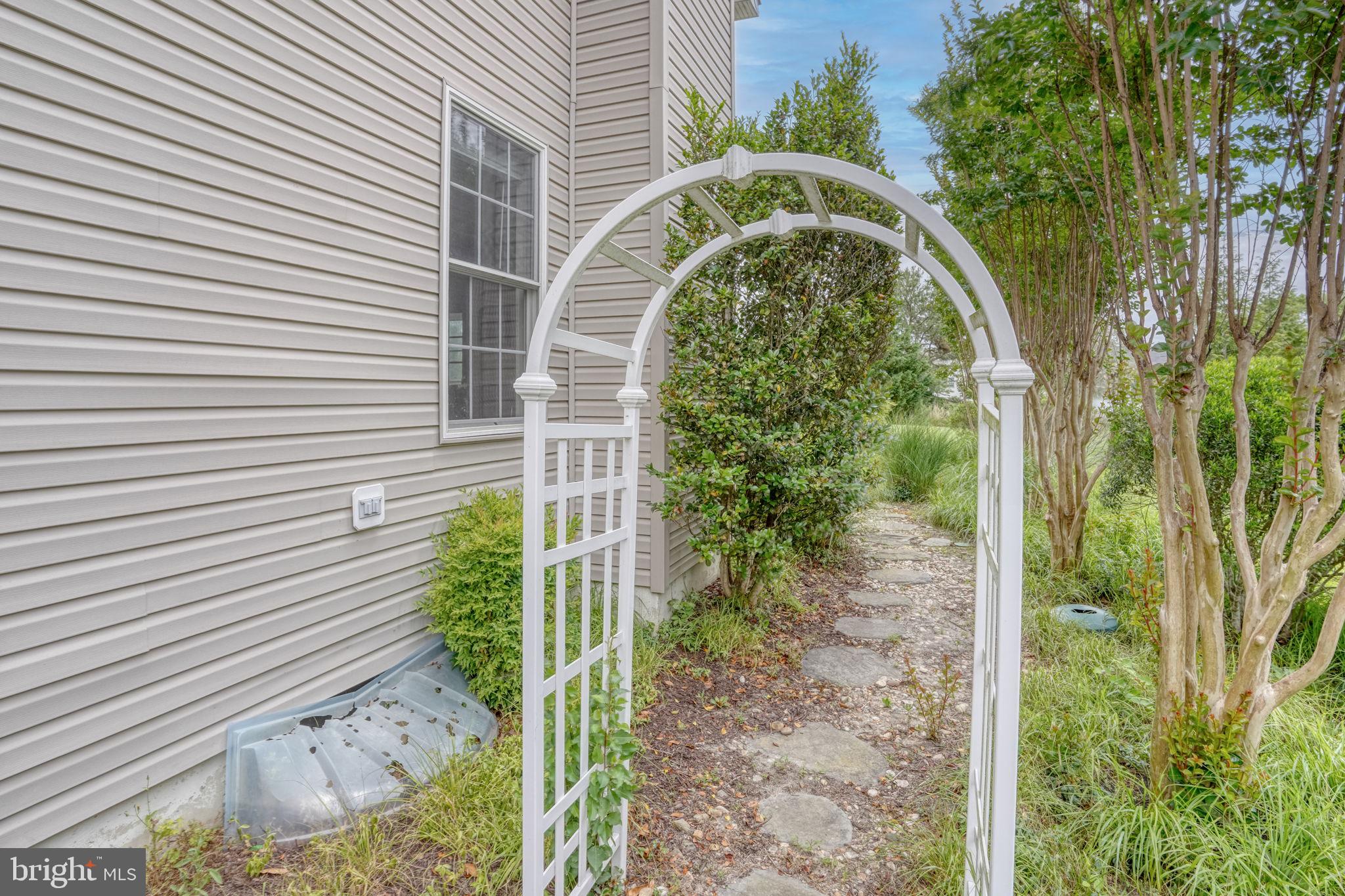 36 Kenmare Way Rehoboth Beach, DE 19971 - Photo 41 of 62 garden archway entrance