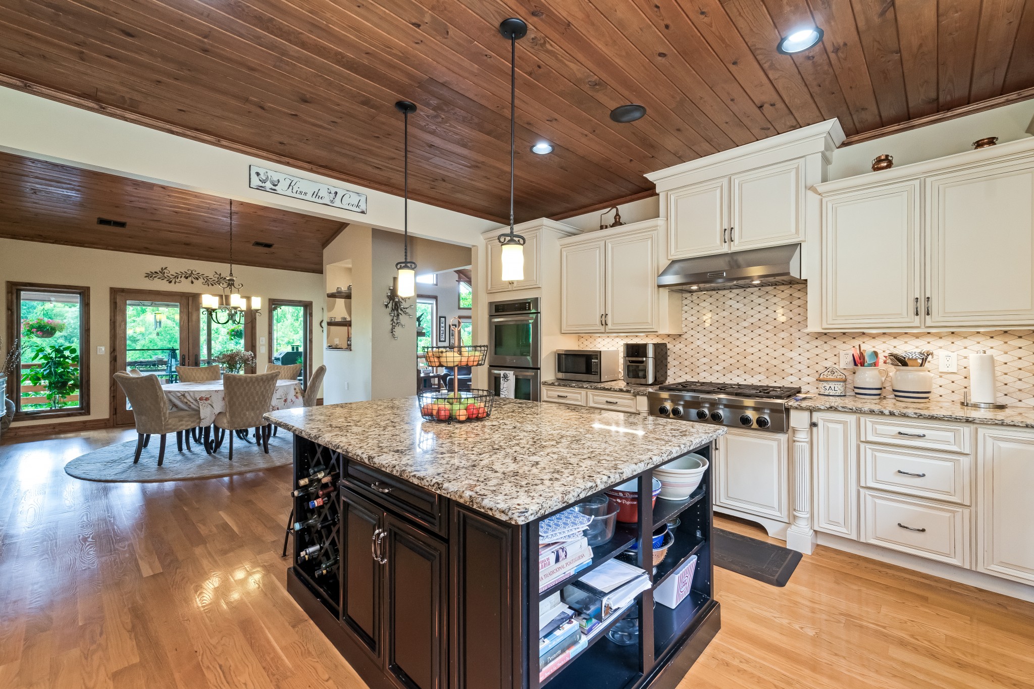 5564 Pinewood Road Franklin, TN 37064 - Photo 13 of 69 a kitchen with stainless steel appliances granite countertop a stove a sink dishwasher and a refrigerator with wooden floor