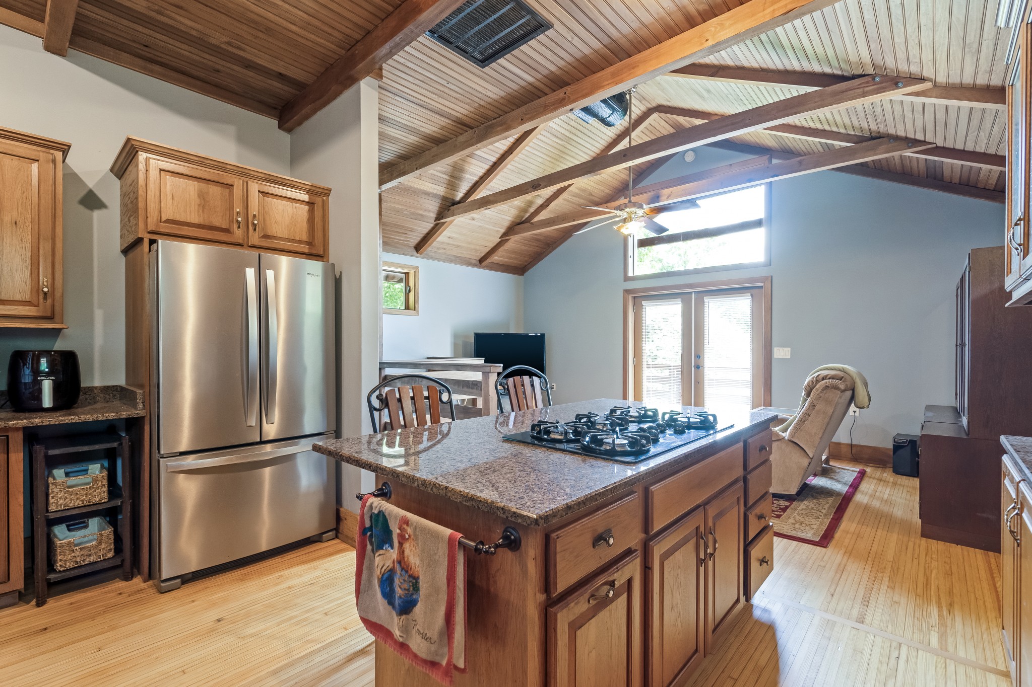 5564 Pinewood Road Franklin, TN 37064 - Photo 46 of 69 a kitchen with stainless steel appliances granite countertop a stove a refrigerator and a dining table