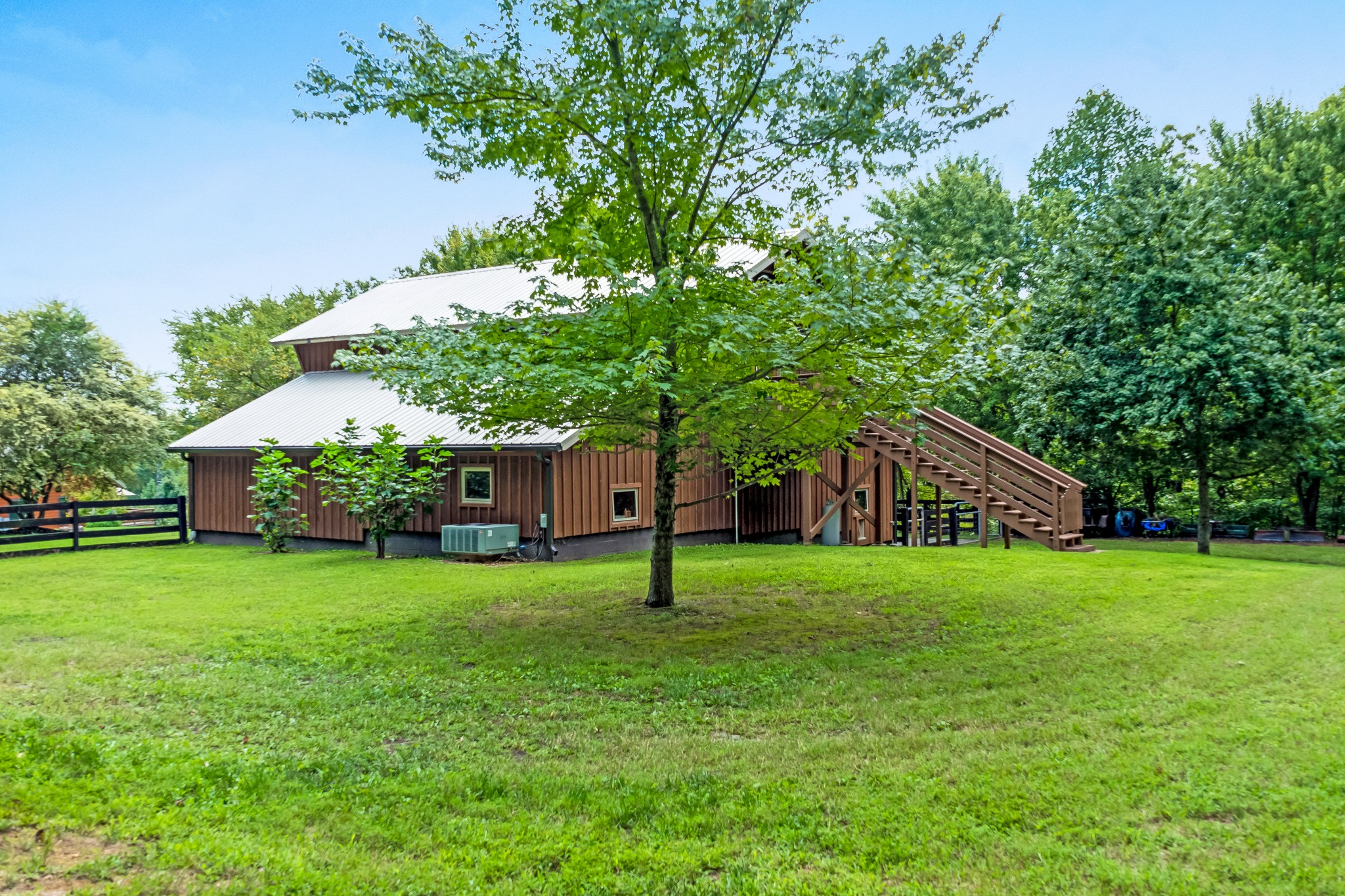 5564 Pinewood Road Franklin, TN 37064 - Photo 52 of 69 a house with a big yard and large trees