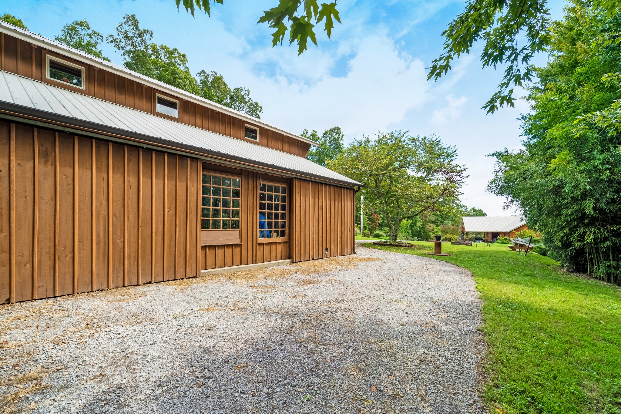 5564 Pinewood Road Franklin, TN 37064 - Photo 53 of 69 a front view of a house with a yard and garage