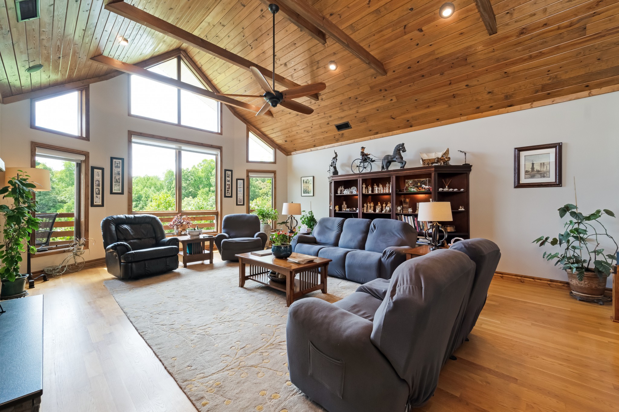 5564 Pinewood Road Franklin, TN 37064 - Photo 9 of 69 a living room with furniture floor to ceiling window and a flat screen tv