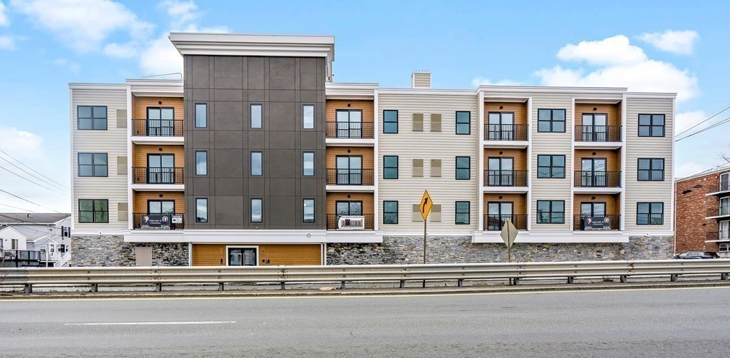 a front view of a building with a street