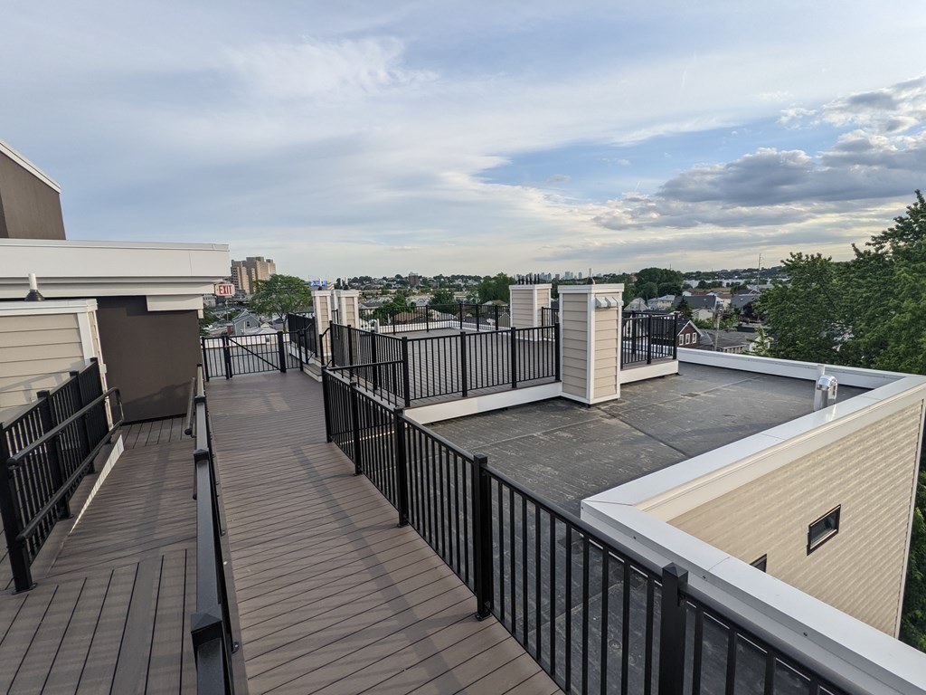 1133 North Shore Road, Unit 205 Revere, MA 02151 - Photo 14 of 20 a view of roof deck with patio