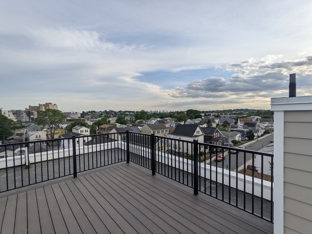 1133 North Shore Road, Unit 205 Revere, MA 02151 - Photo 15 of 20 a view of a balcony with wooden floor