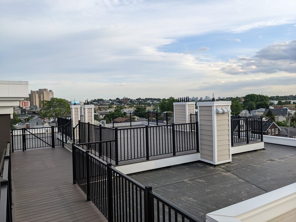 1133 North Shore Road, Unit 205 Revere, MA 02151 - Photo 16 of 20 a view of a balcony with city view