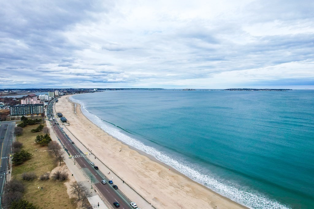 1133 North Shore Road, Unit 205 Revere, MA 02151 - Photo 20 of 20 a view of a yard with an ocean