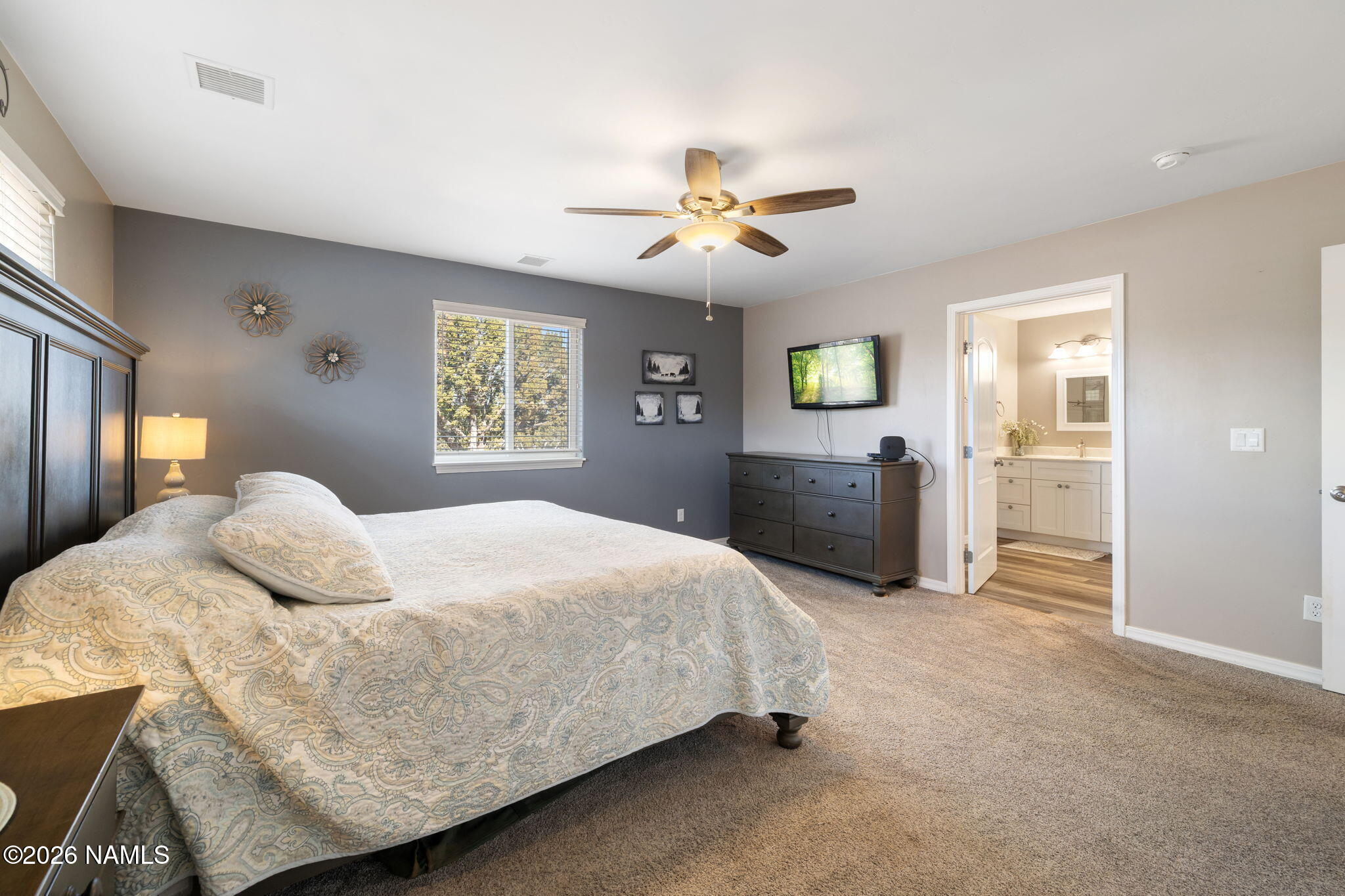 6339 North Bluefield Road Flagstaff, AZ 86004 - Photo 13 of 35 a bedroom with a bed and window