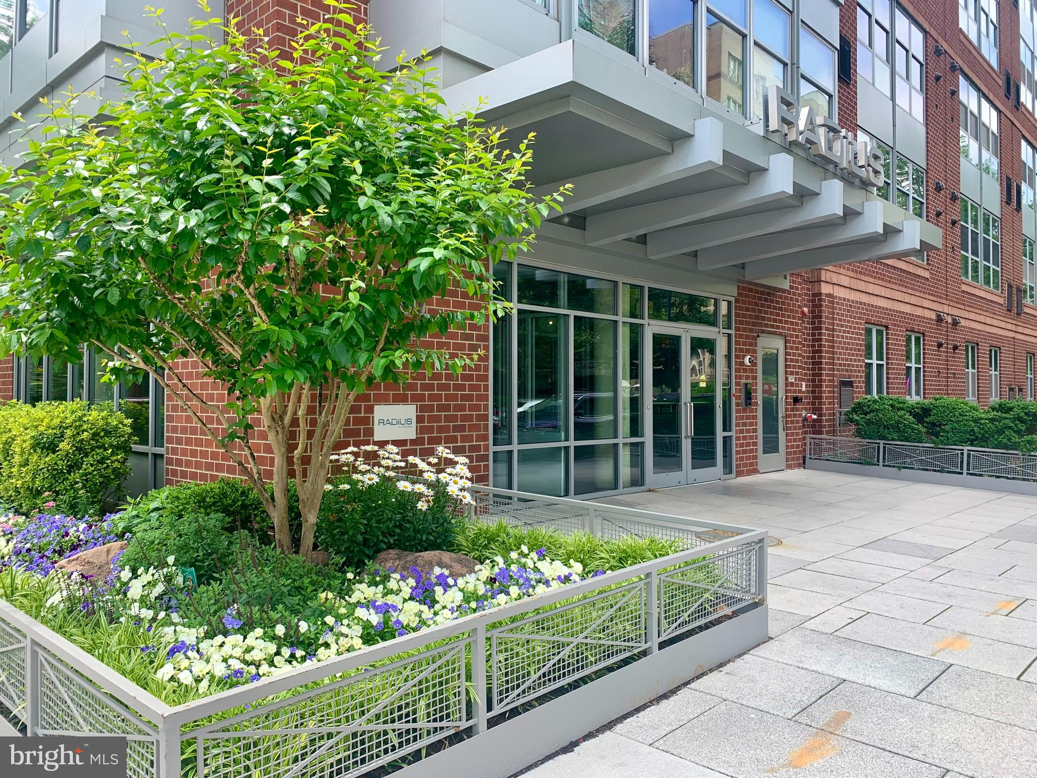 front view of a house with a garden