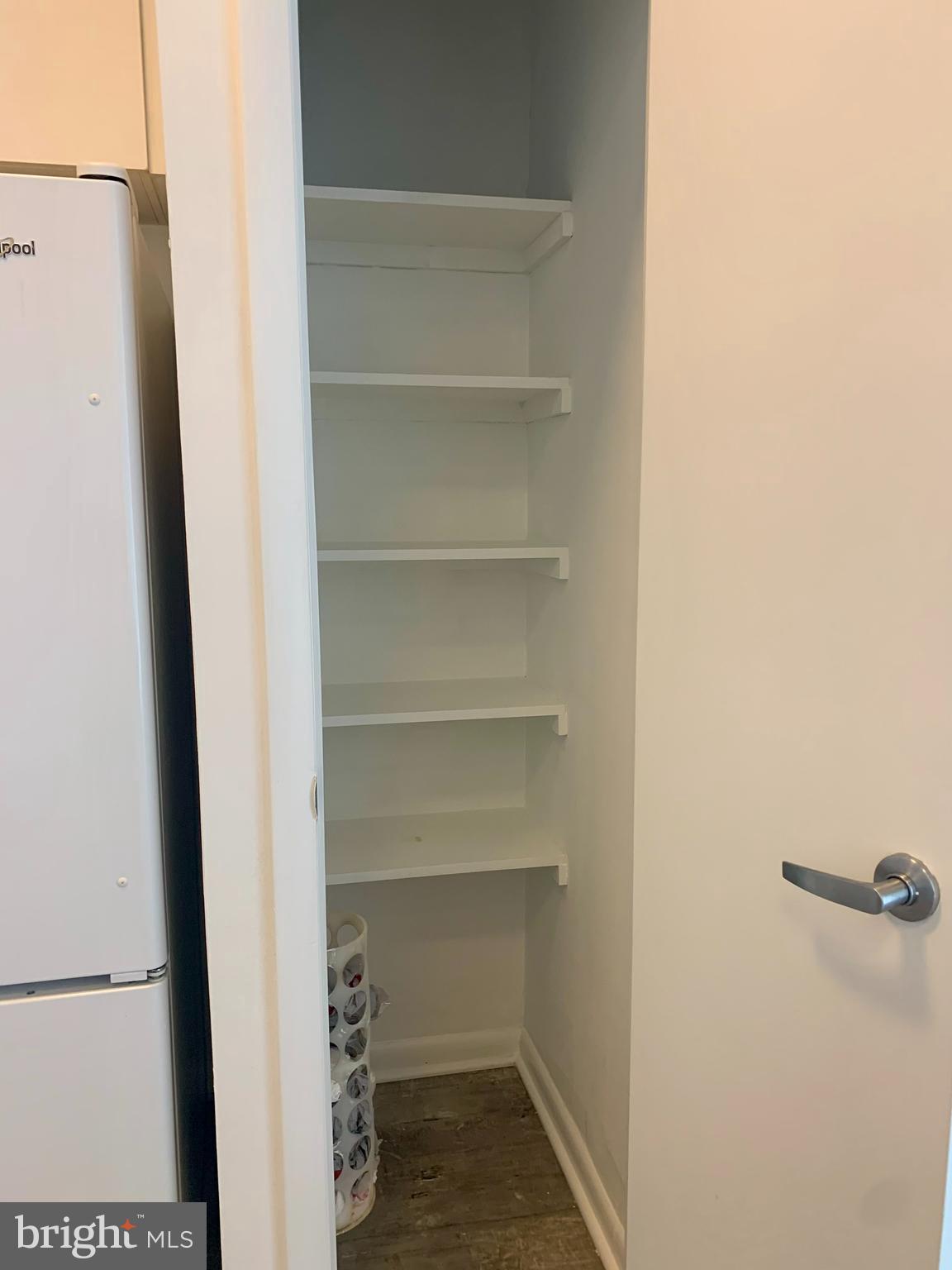 1300 N Street Northwest, Unit 508 Washington, DC 20005 - Photo 13 of 19 a view of walk in closet with empty racks