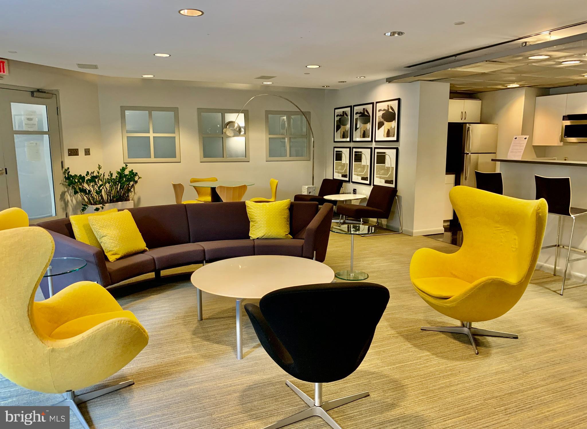 1300 N Street Northwest, Unit 508 Washington, DC 20005 - Photo 18 of 19 a living room with furniture and a table