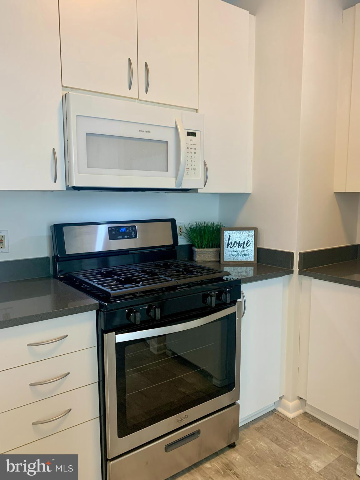 1300 N Street Northwest, Unit 508 Washington, DC 20005 - Photo 5 of 19 a stove top oven sitting inside of a kitchen
