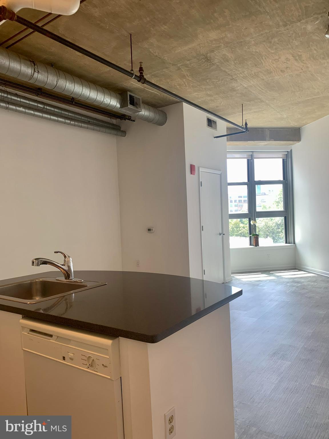 1300 N Street Northwest, Unit 508 Washington, DC 20005 - Photo 10 of 19 a view of a kitchen that has a sink and cabinets