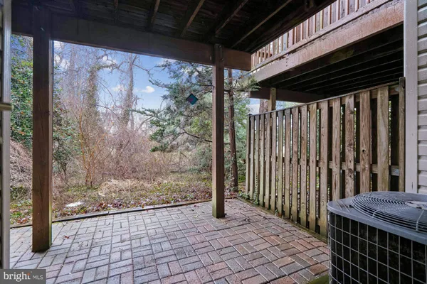 a view of a porch with wooden floor