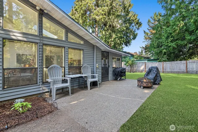 a view of a two chairs in the patio