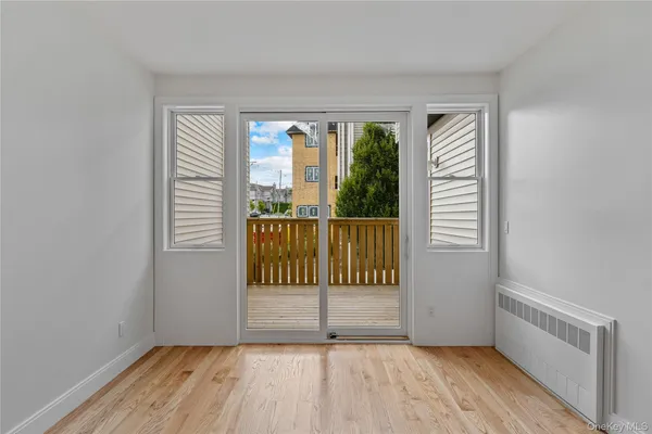 a view of a room with wooden floor and walls
