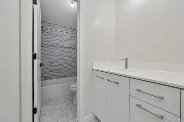 a bathroom with a sink and mirror