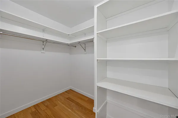 a view of an empty walk in closet