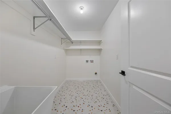 a bathroom with a shower and closet