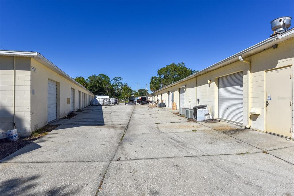 703 South State Street Bunnell, FL 32110 - Photo 20 of 25 a view of a house with a backyard