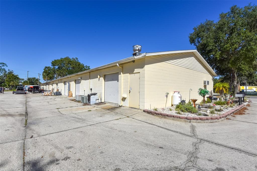 703 South State Street Bunnell, FL 32110 - Photo 21 of 25 a backyard of a house with table and chairs