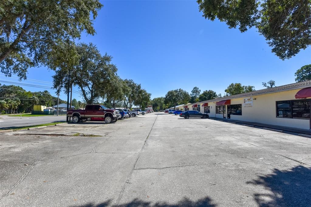 703 South State Street Bunnell, FL 32110 - Photo 6 of 25 a view of street with parked cars
