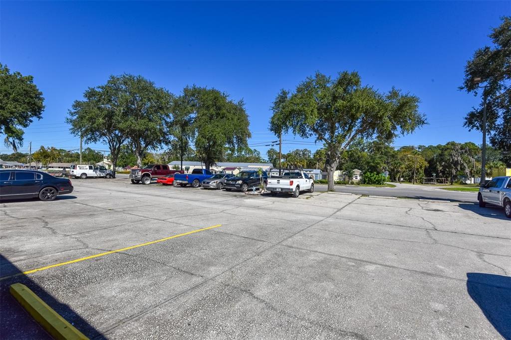 703 South State Street Bunnell, FL 32110 - Photo 8 of 25 a cars parked on the side of a street