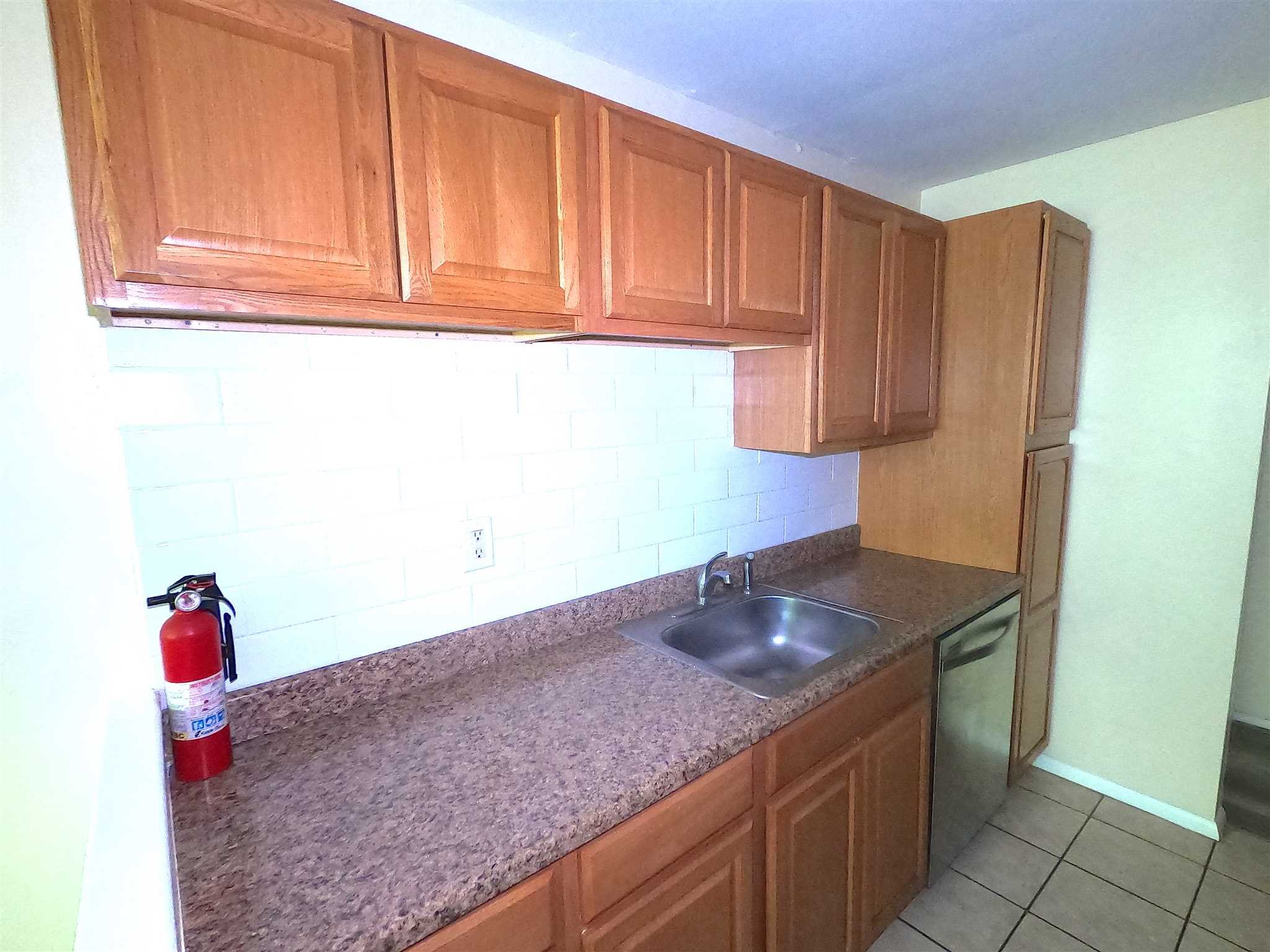 3 Hook Hyde Park, Unit 14A Poughkeepsie, NY 12601 - Photo 6 of 20 a kitchen with granite countertop a sink and cabinets