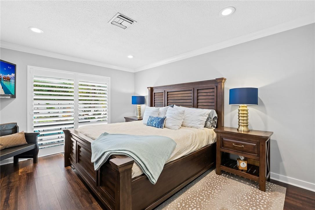 1621 Northwest 10th Street Boca Raton, FL 33486 - Photo 11 of 25 a bedroom with a bed and a table in it