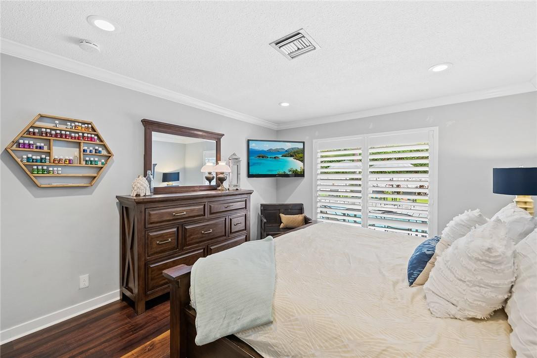 1621 Northwest 10th Street Boca Raton, FL 33486 - Photo 12 of 25 a bedroom with a bed and a desk