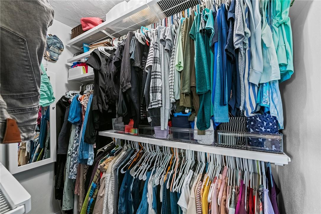 1621 Northwest 10th Street Boca Raton, FL 33486 - Photo 13 of 25 a view of walk in closet with clothes