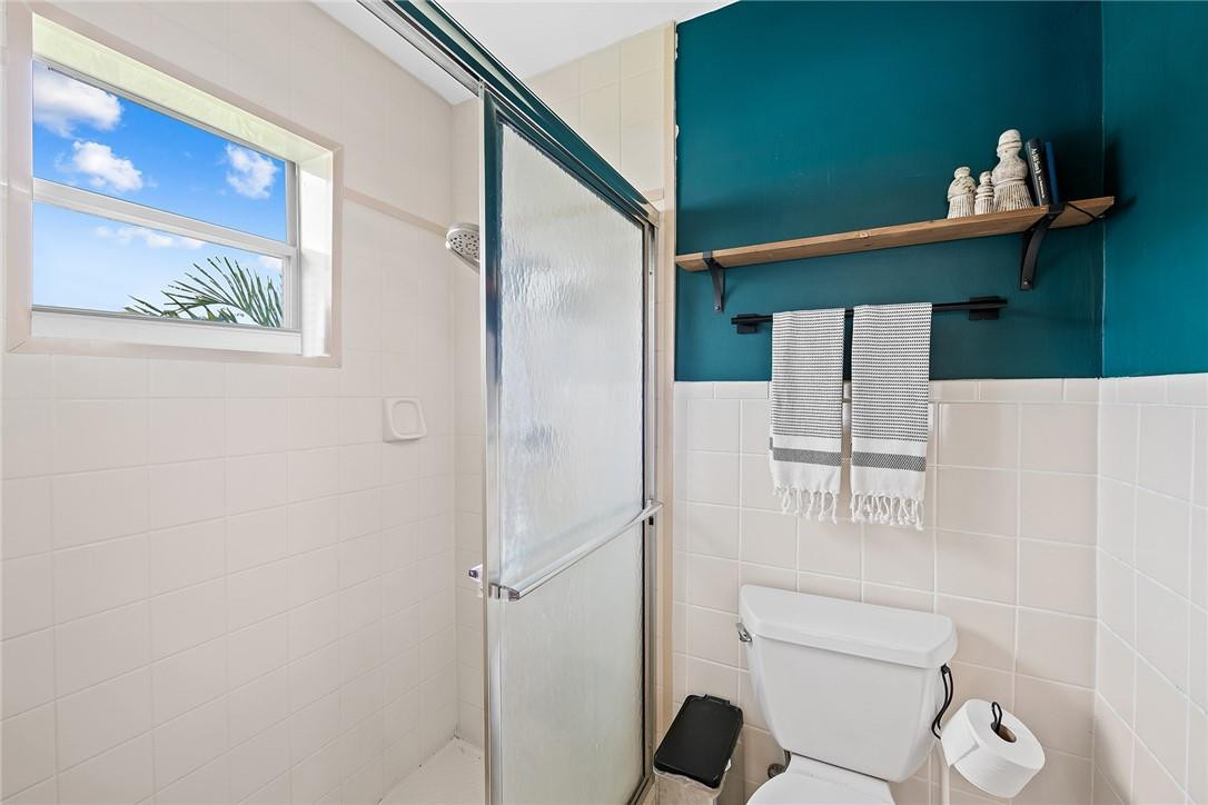 1621 Northwest 10th Street Boca Raton, FL 33486 - Photo 17 of 25 a bathroom with a toilet and a shower