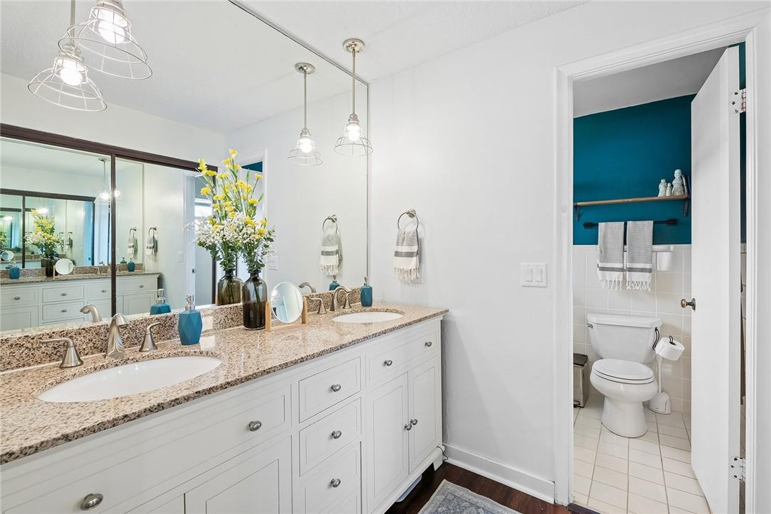 1621 Northwest 10th Street Boca Raton, FL 33486 - Photo 18 of 25 a bathroom with a granite countertop sink mirror and toilet