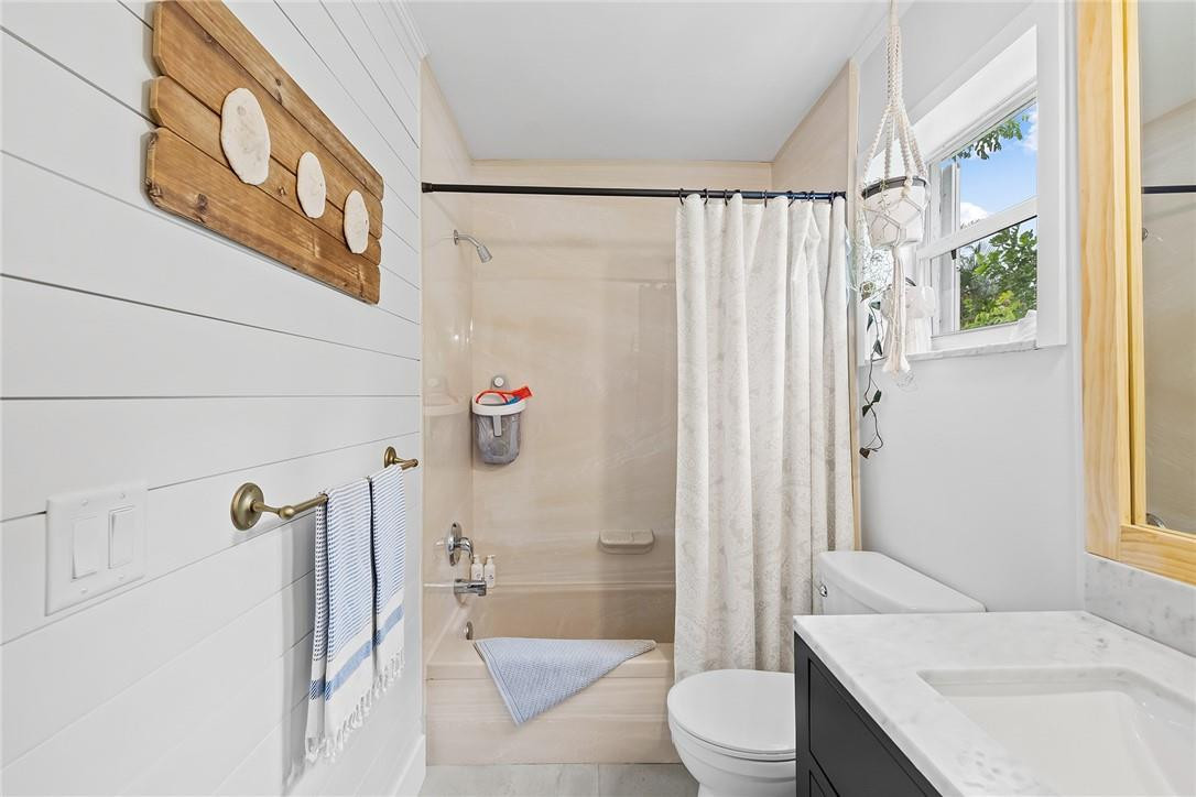 1621 Northwest 10th Street Boca Raton, FL 33486 - Photo 20 of 25 a bathroom with a sink toilet and shower