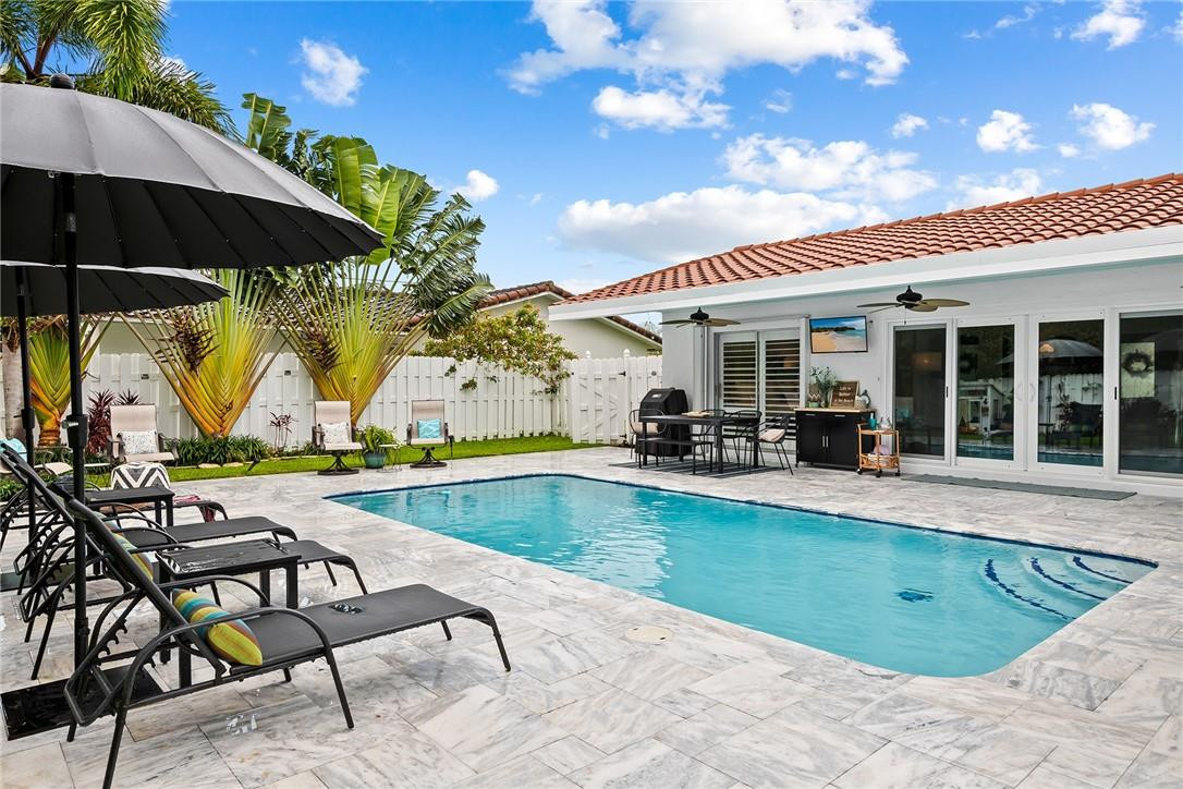 1621 Northwest 10th Street Boca Raton, FL 33486 - Photo 21 of 25 a view of swimming pool with outdoor seating space