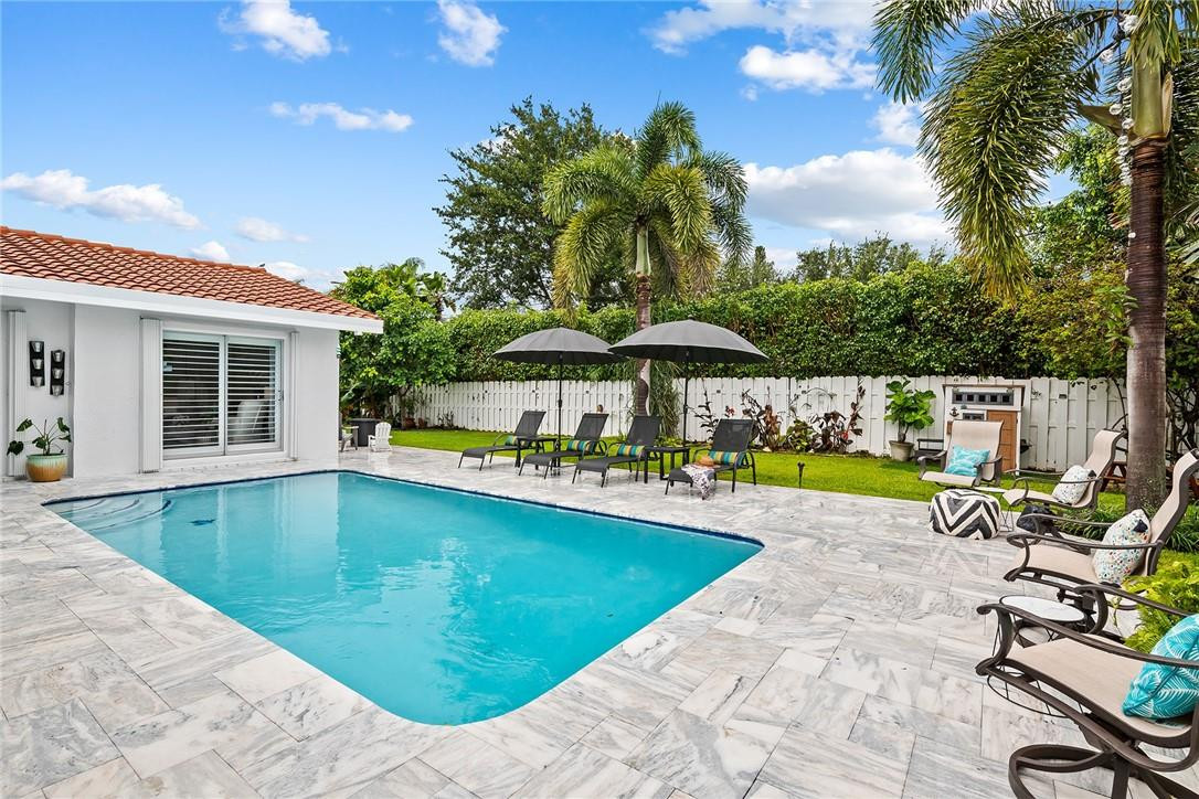1621 Northwest 10th Street Boca Raton, FL 33486 - Photo 22 of 25 a view of a swimming pool with a patio