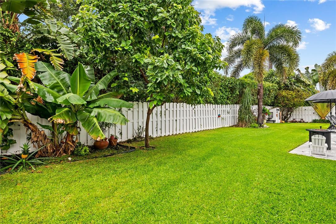 1621 Northwest 10th Street Boca Raton, FL 33486 - Photo 24 of 25 a view of a backyard with a slide
