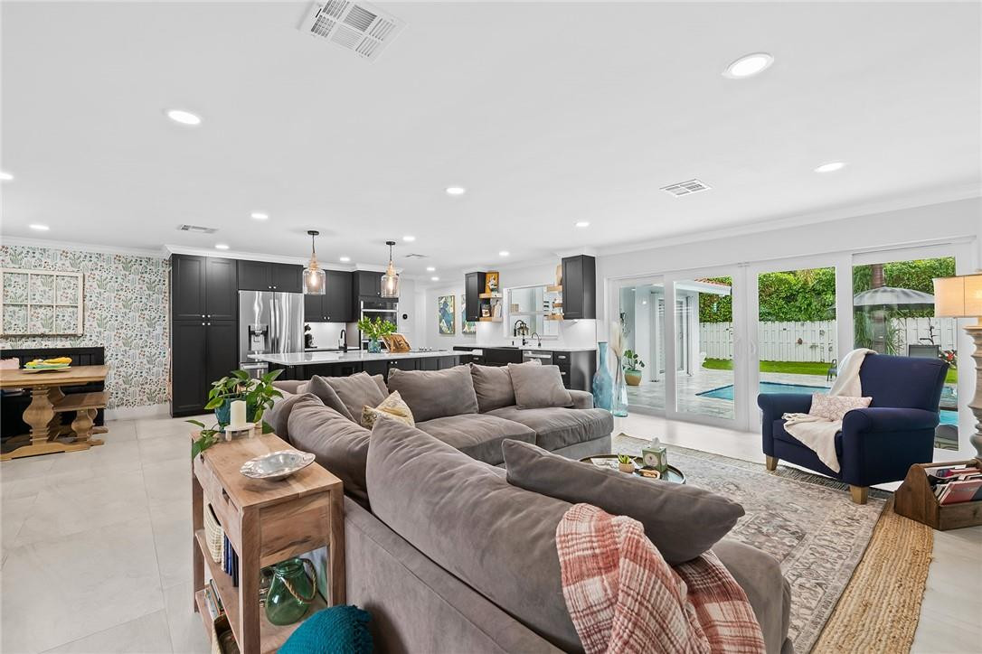 1621 Northwest 10th Street Boca Raton, FL 33486 - Photo 7 of 25 a living room with furniture and a large window